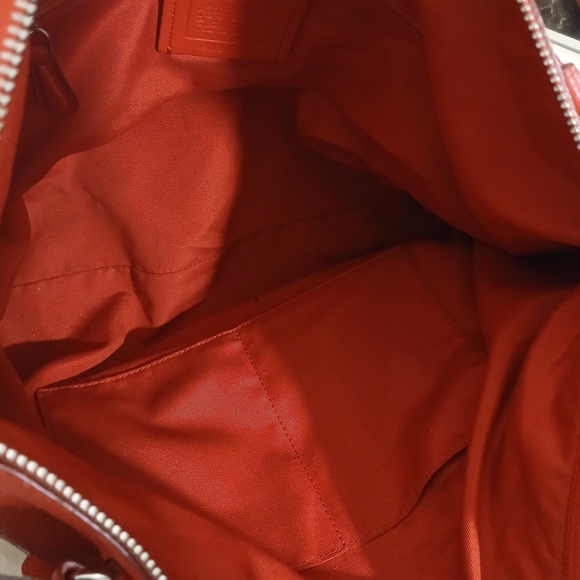 Coach Tyler Tote in an orange/red shade of pebbled leather. - Picture 8 of 16